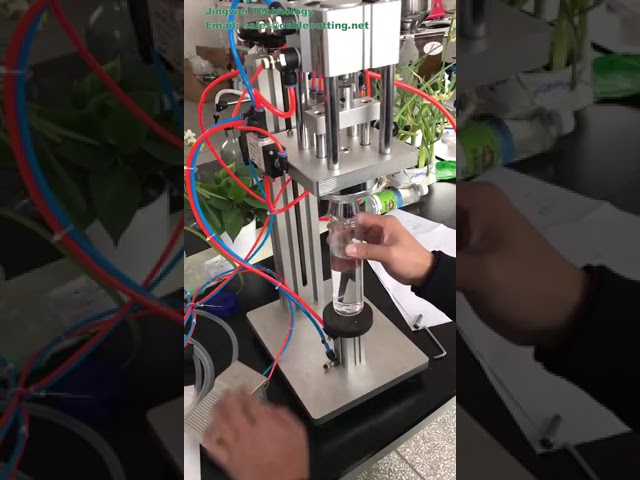 Semi-automatisk pneumatisk parfymekrympe- og kapslingsmaskin